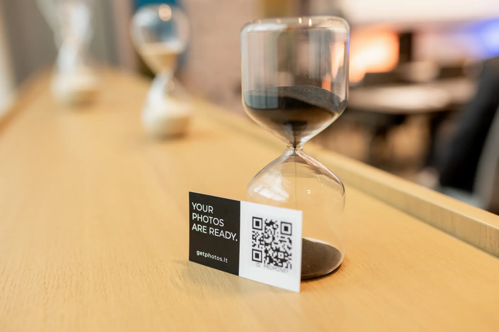 A card with a QR code and gallery ID on an event table