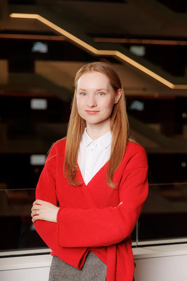 Young woman in a red cardigan