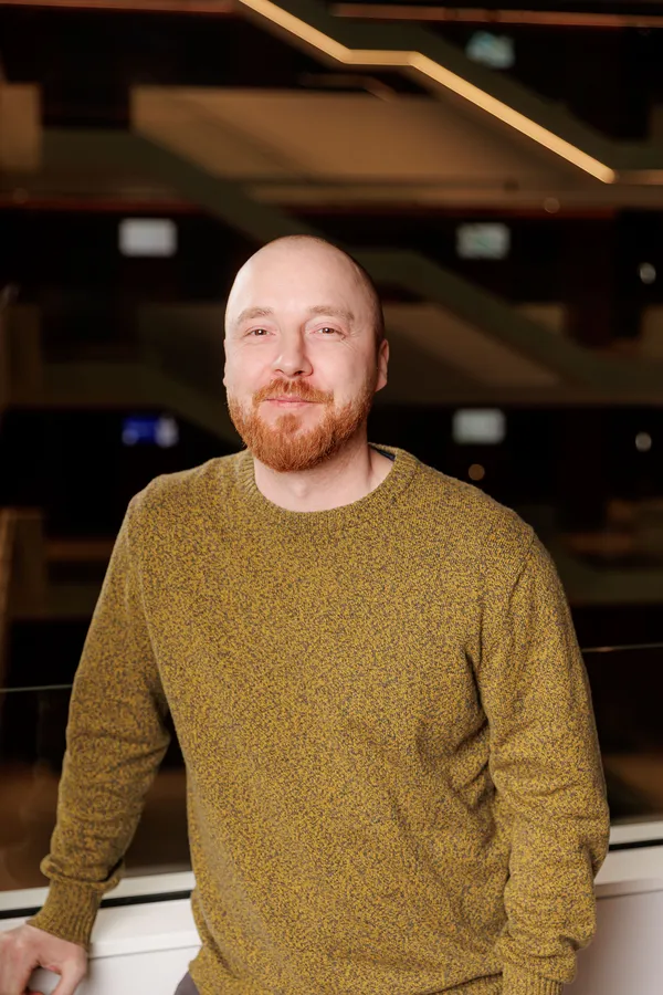 Bearded man in an olive jumper