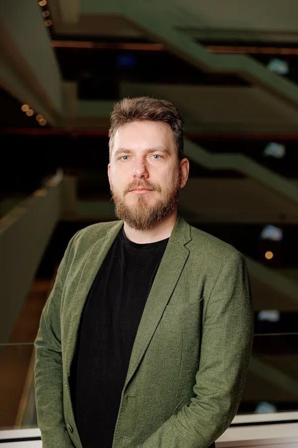 Bearded man in a green blazer