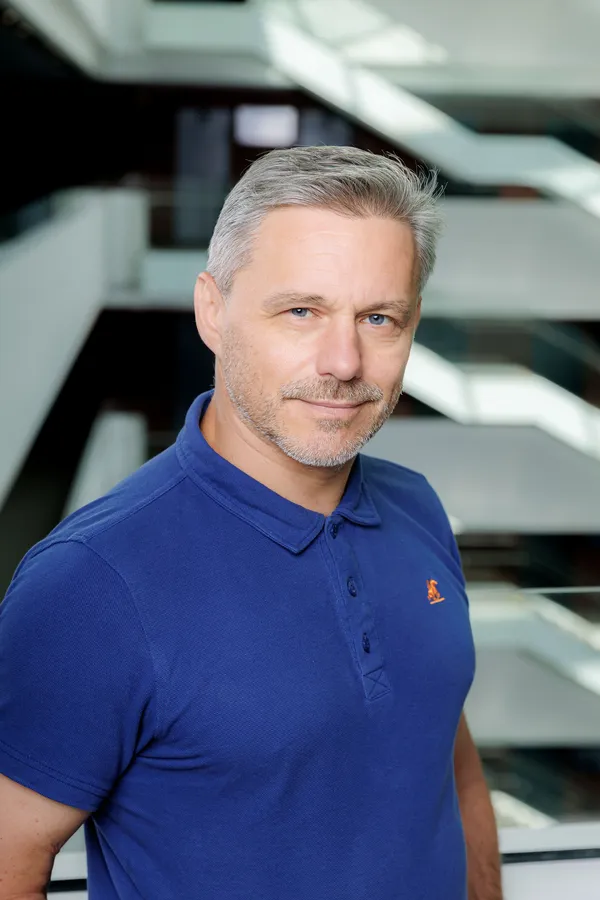 Man in a blue polo shirt